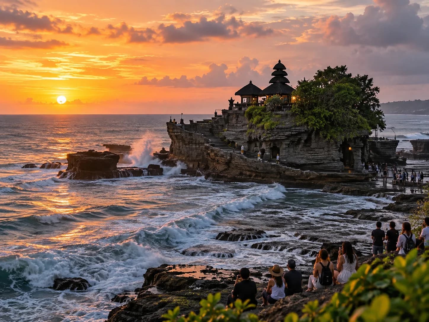 Balinese inspired sea temple and tropical coastline at sunset